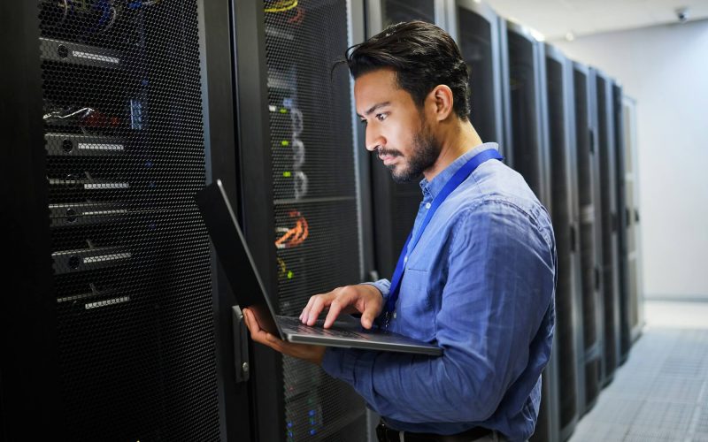 Cybersecurity trainer reviewing incident logs with a student in Hyderabad